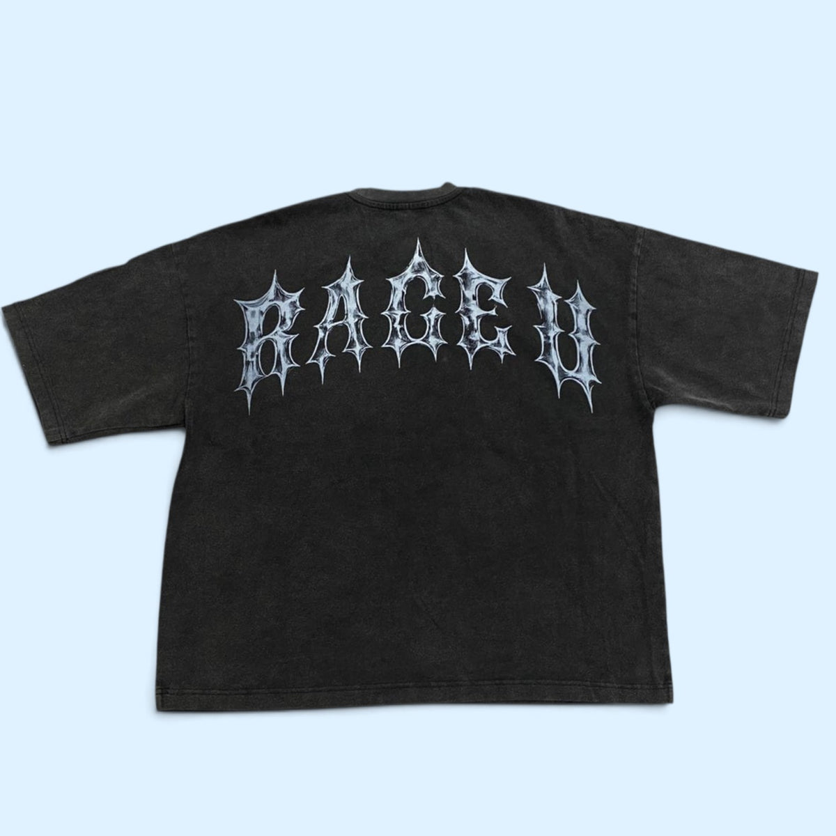 The Origin Heavyweight Tee — Vintage Black back view with chrome RAGE U gothic lettering across the upper back