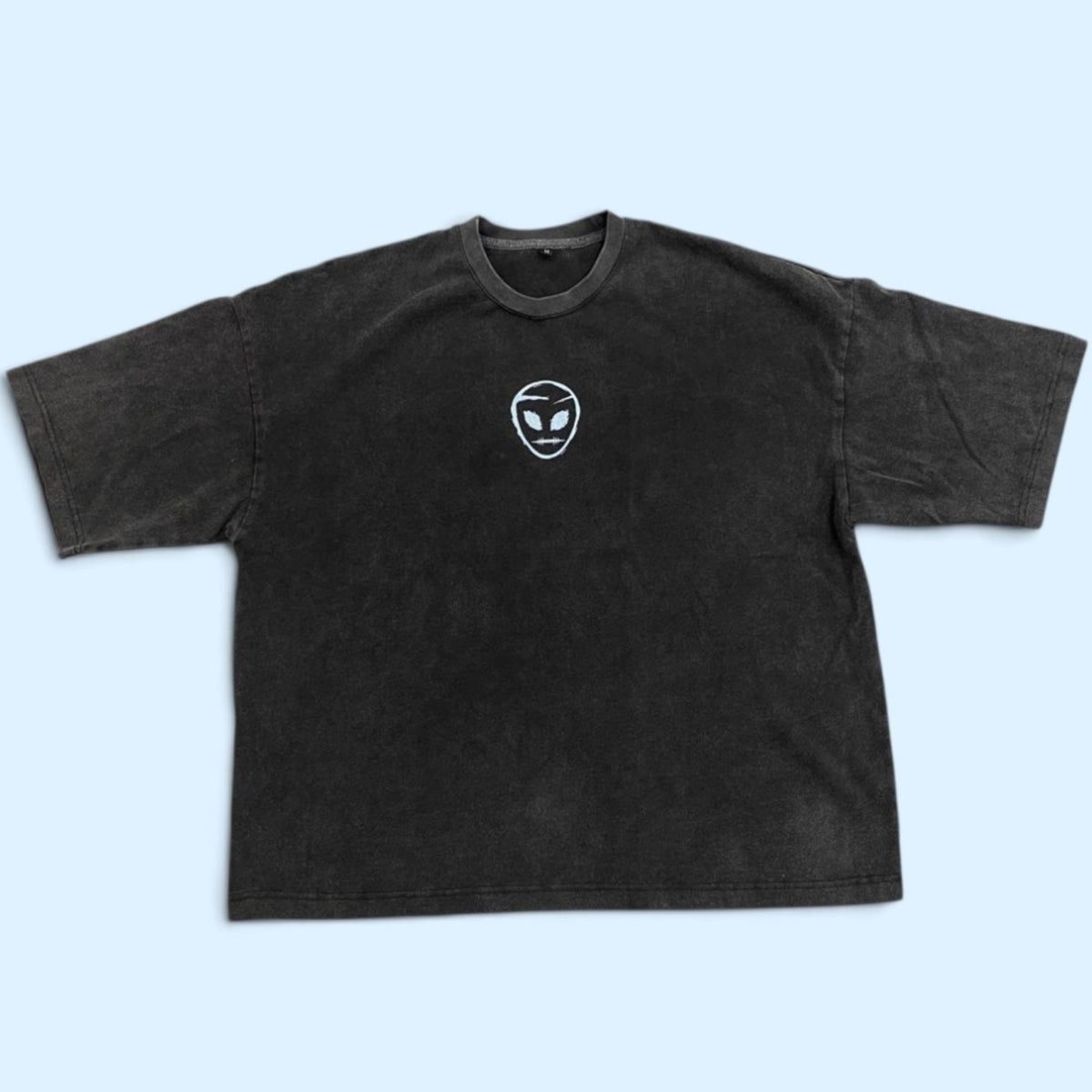 The Origin Heavyweight Tee — Vintage Black front view: heavyweight 300 GSM cotton boxy tee with white alien insignia on the chest